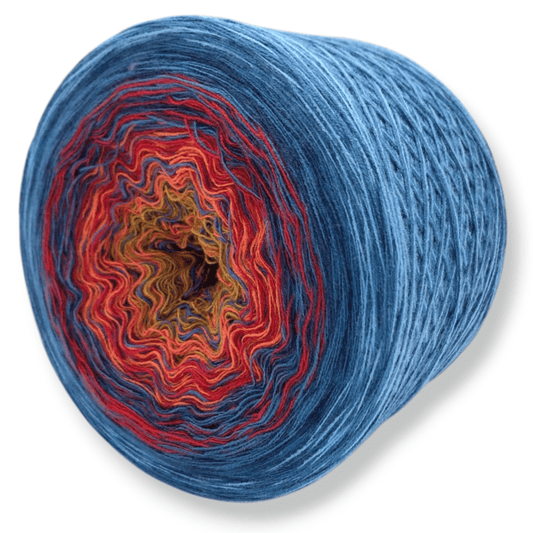 Farbvariante VOLL VERRÜCKT zeigt einen intensiven Farbwechsel von warmem Rot und Orange zu senfgelb und kühlem Blau, handgefärbte Modal Farbverlaufsgarne aus natürlichen Fasern – Modal Farbverlaufsgarn zum Verlieben.